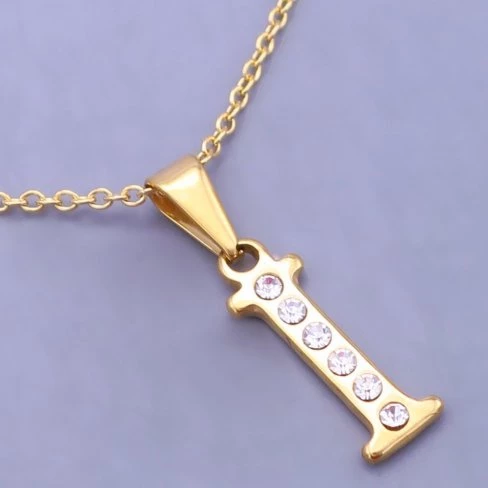 Zlacené písmeno I z chirurgické oceli